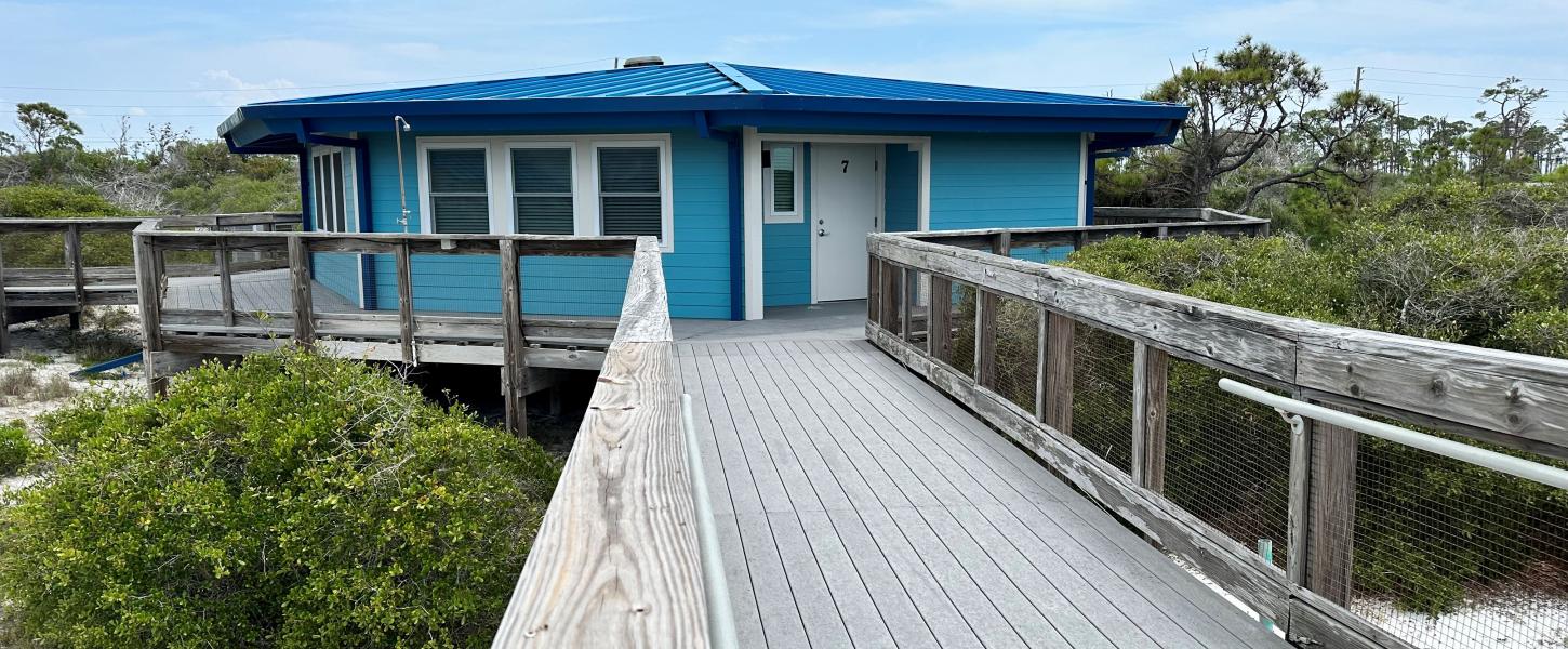 A boardwalk leads to Cabin 8