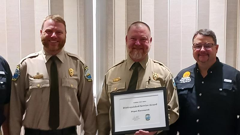 Bryan Kaczmarek receives an award from Chuck Hatcher, Billy Baily, Brian Fugate and Steve Cutshaw.