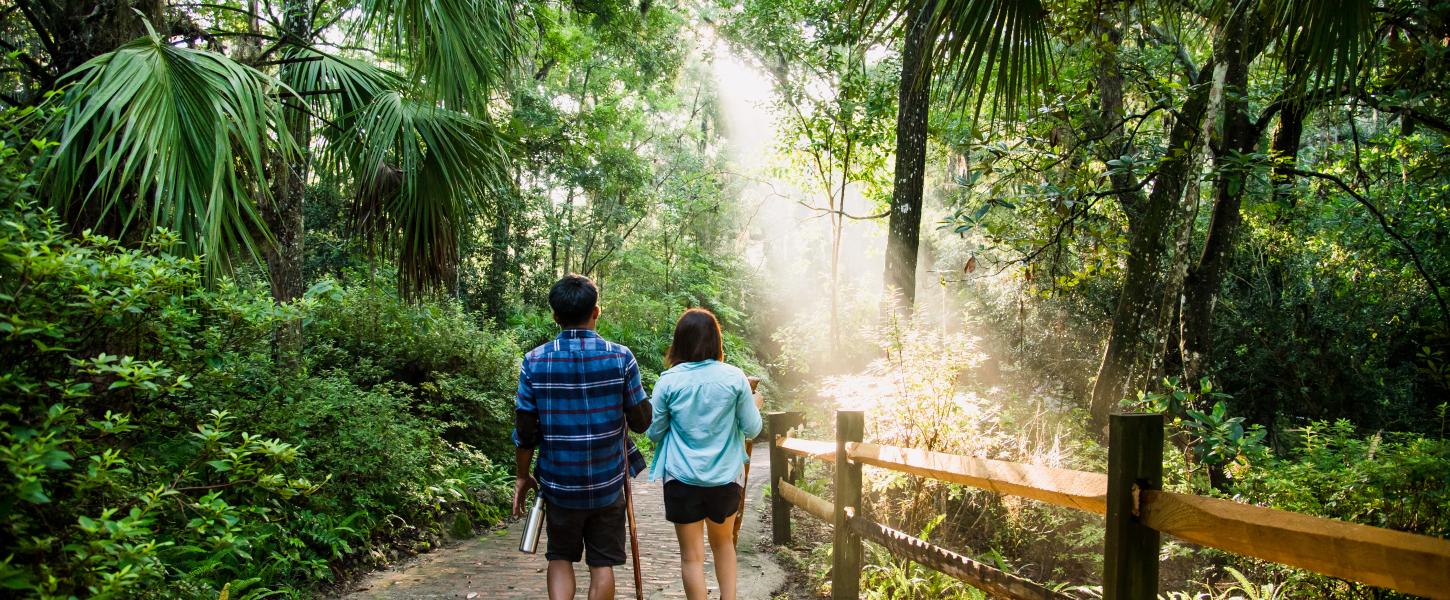 Two people hike at Rainbow Springs State Park.