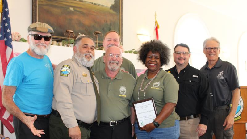 Members of the Stephen Foster CSO receive the award.