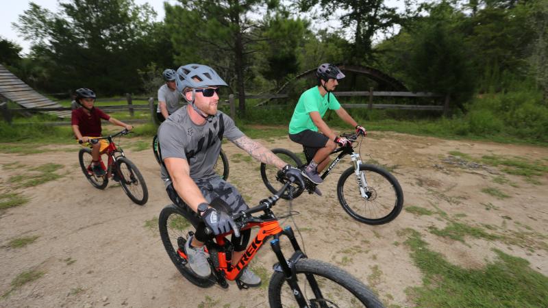 4 mountain bike riders on their bikes at the vortex